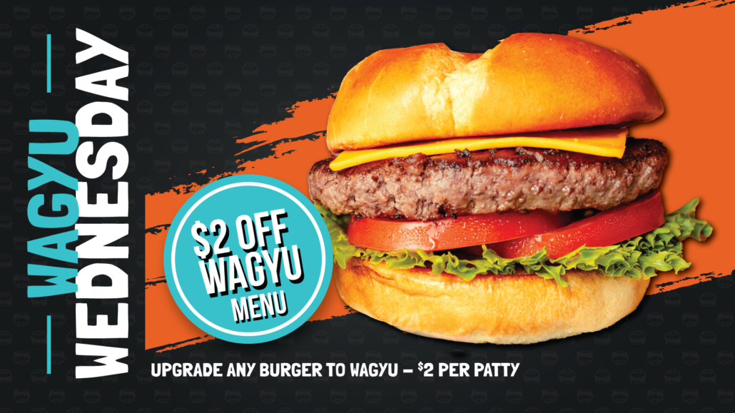 Savory wagyu beef burger with cheese, lettuce, and tomatoes.