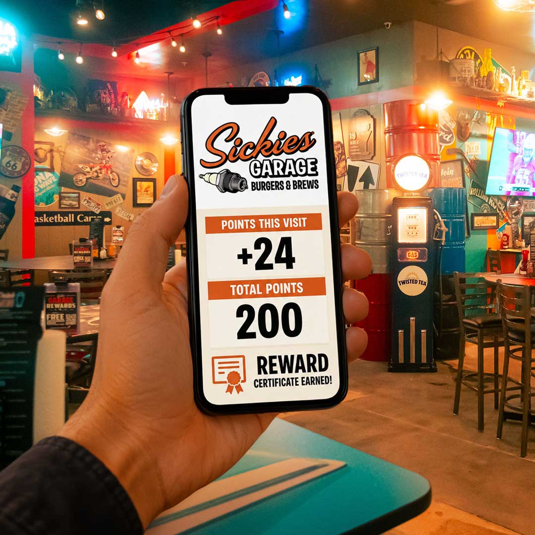 A hand hoklding a mobile phone showing rewards point accumulation on an app